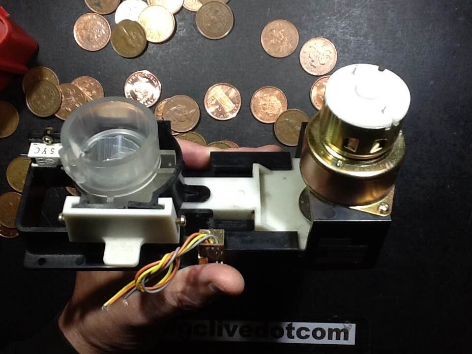 Unusual motorised coin payout mechanism.