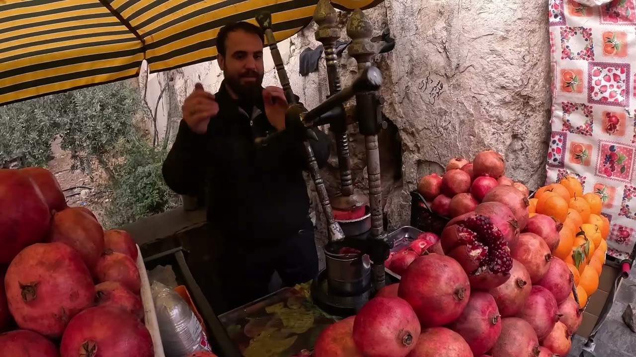Squeezing the Freshest Pomegranate Juice in Damascus, Syria