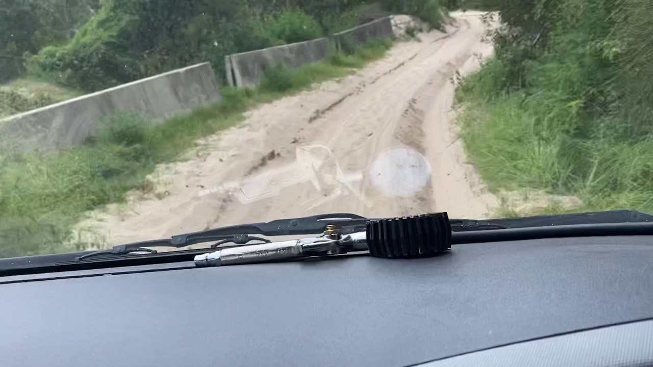 Full-Time 4WD Toyota Hiace (Japan Import) traversing deep sand over onto the beach