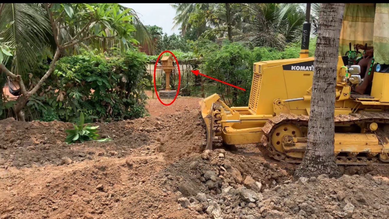 Creative skills talented operating Bulldozer komatsu D20A pushing hard .