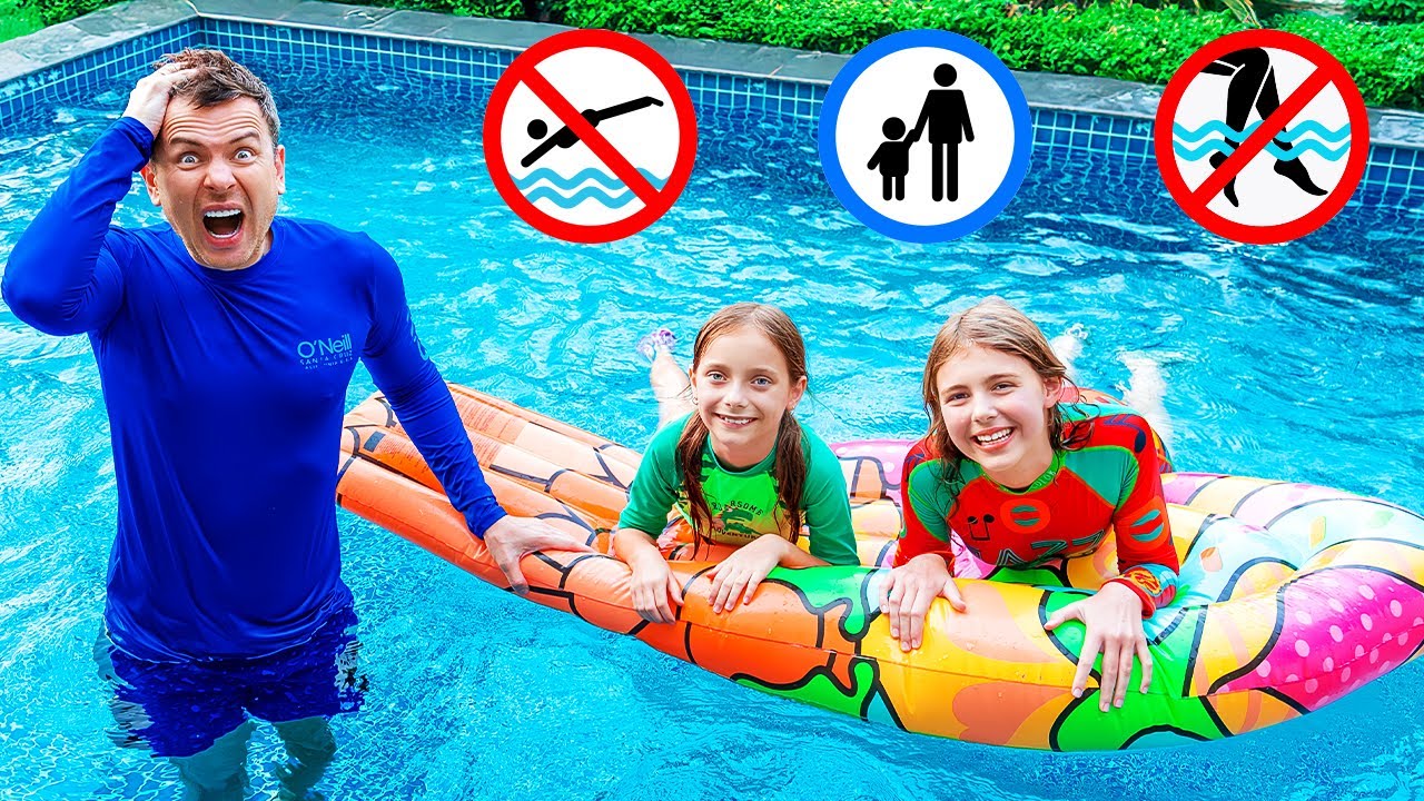 Papa zeigt die Regeln der Poolsicherheit