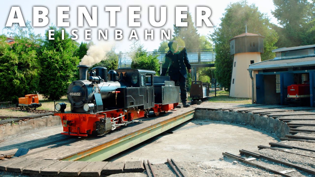 Modellbahnpark Auenhain im Sommer mit Rügenlok, V180 und Straßenbahn