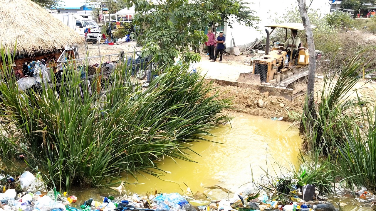Start Amazing work with bulldozer and Trucks start pushing rock to the forest and water