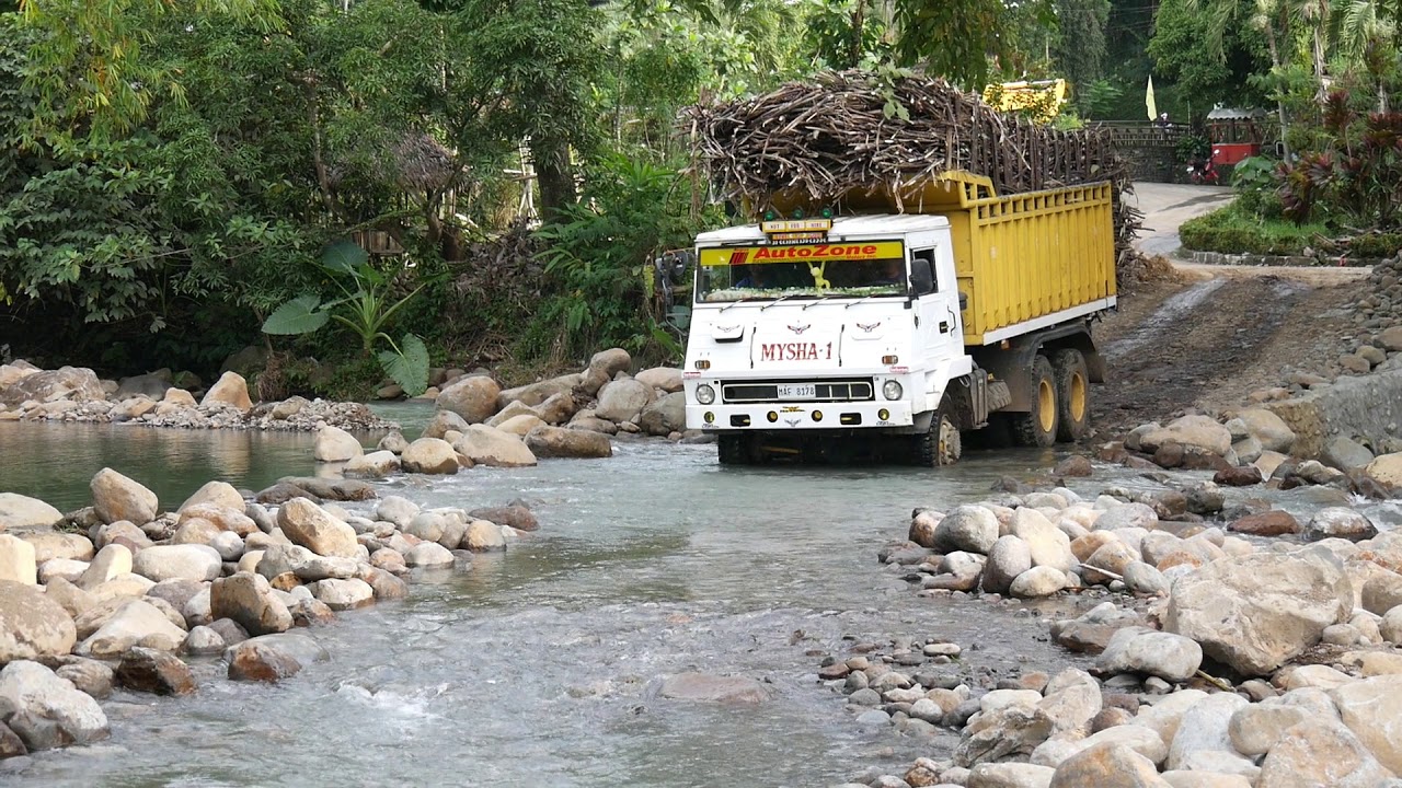 Loaded Sugarcane Truck crosses river