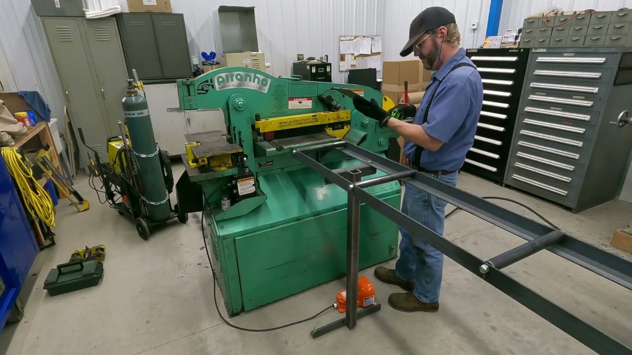 Piranha Ironworker shearing some steel flat bar
