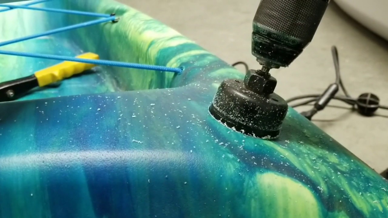 installing fishing rod holders on a kayak