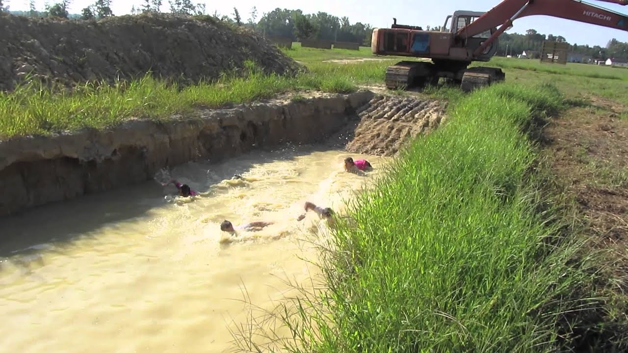 Wade through first mud pit