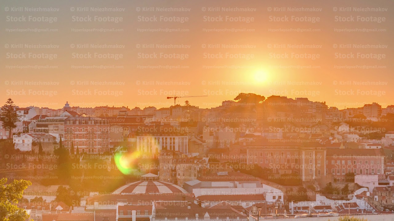 Sunrise over Lisbon aerial cityscape skyline timelapse from viewpoint of St. Peter of Alcantara