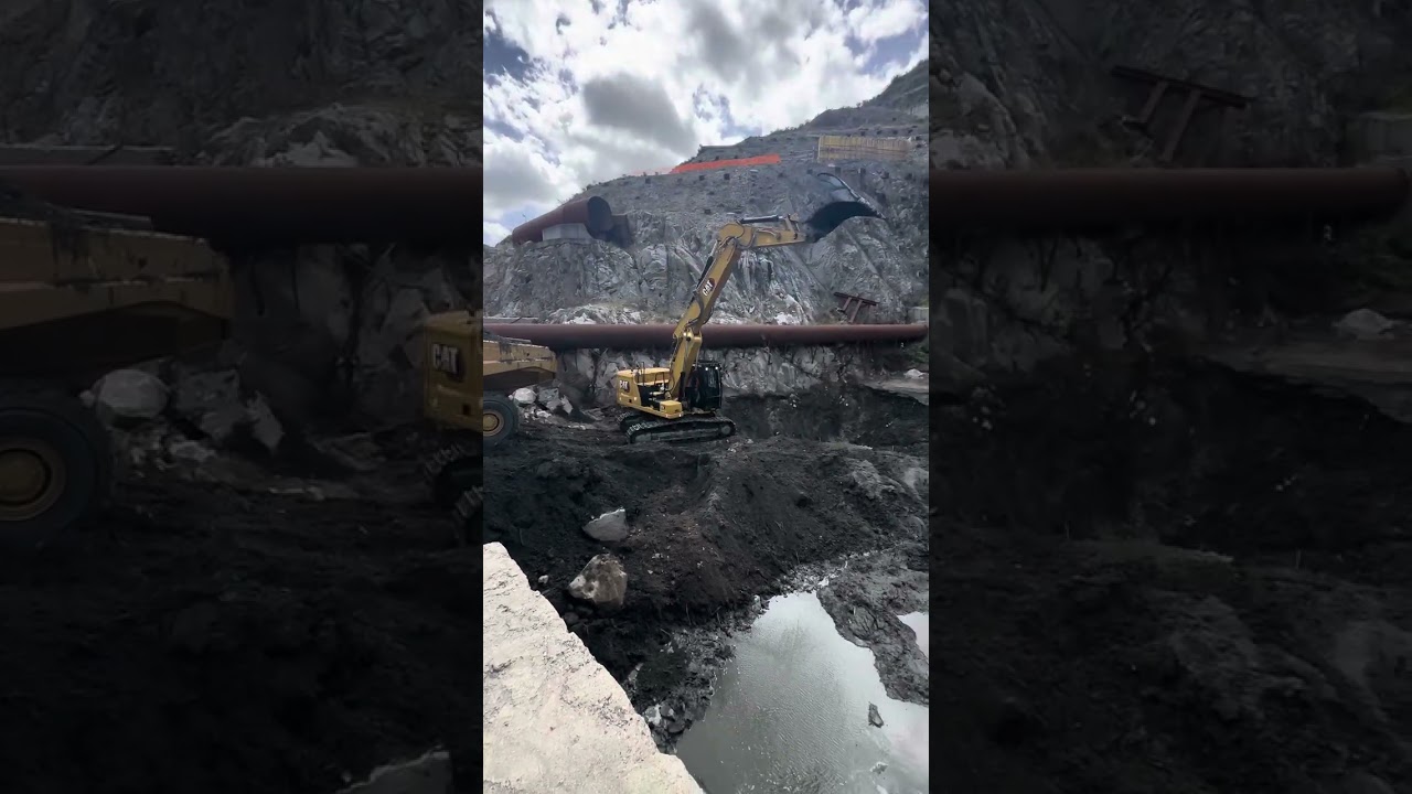 CAT 323 ng SA in diga