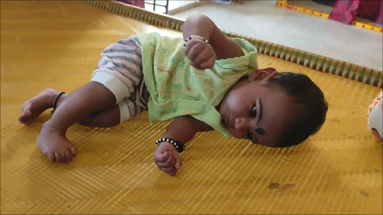 Two months old baby trying to roll over 