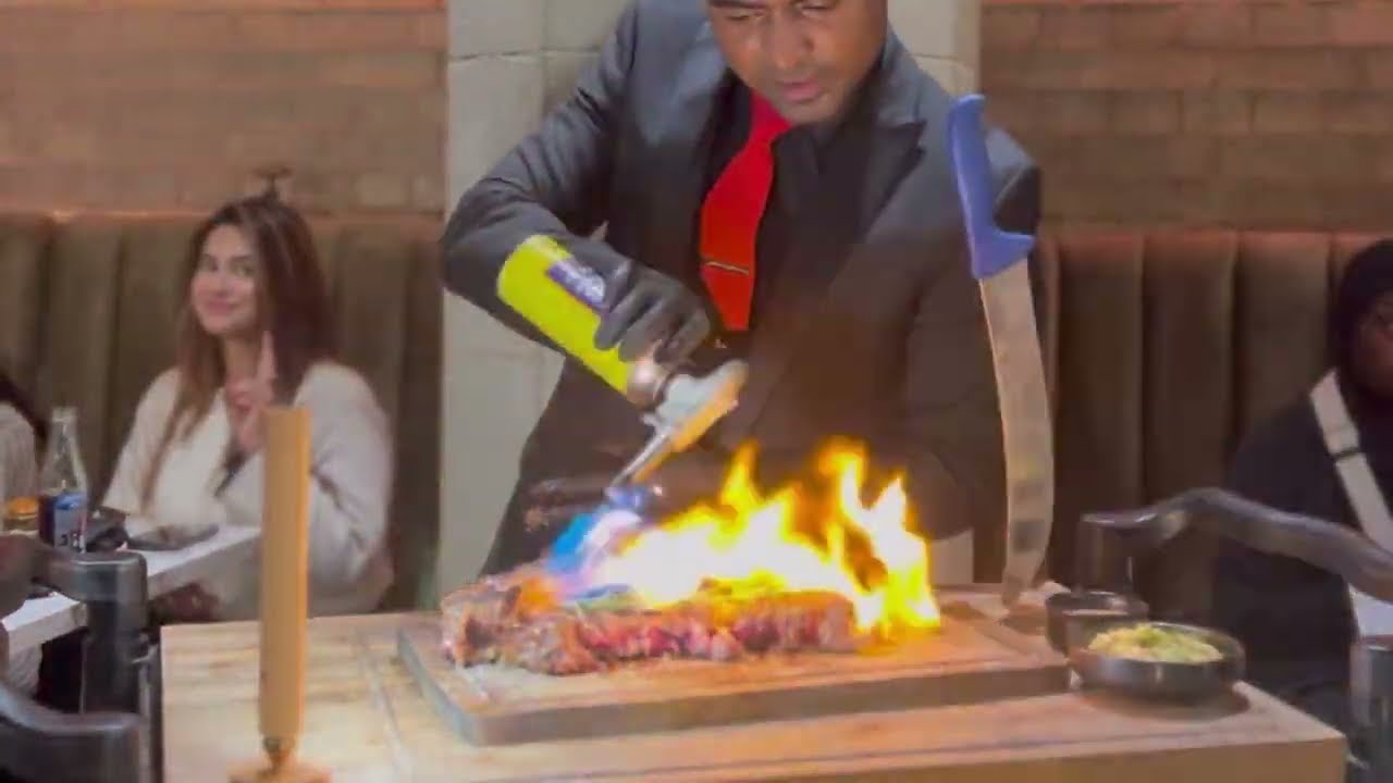 Watch Chefs Create Culinary Art with Tableside Service