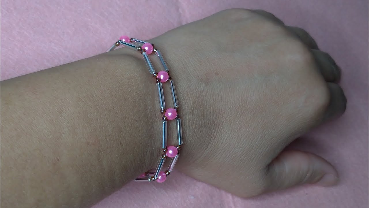 Pulseira entrelaçada com canutilhos