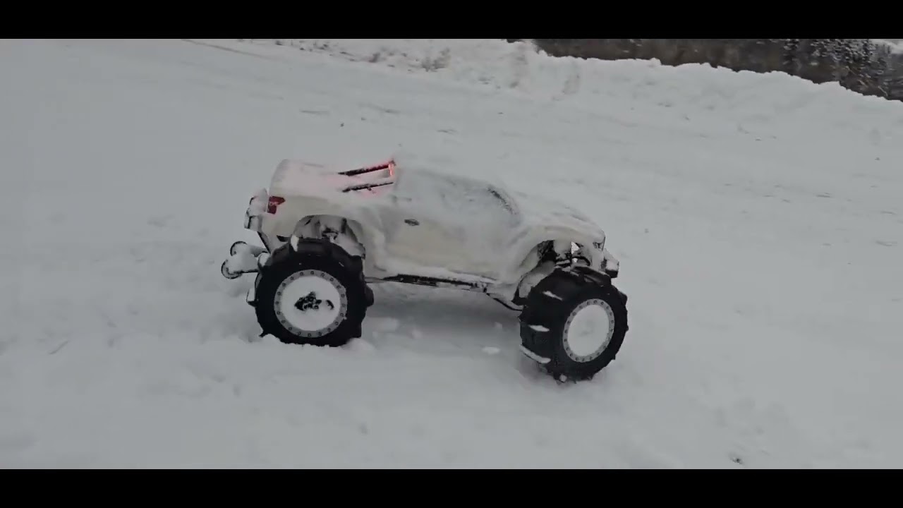 TRAXXAS XMAXX  IN ACTION IN THE SNOW!!!!!