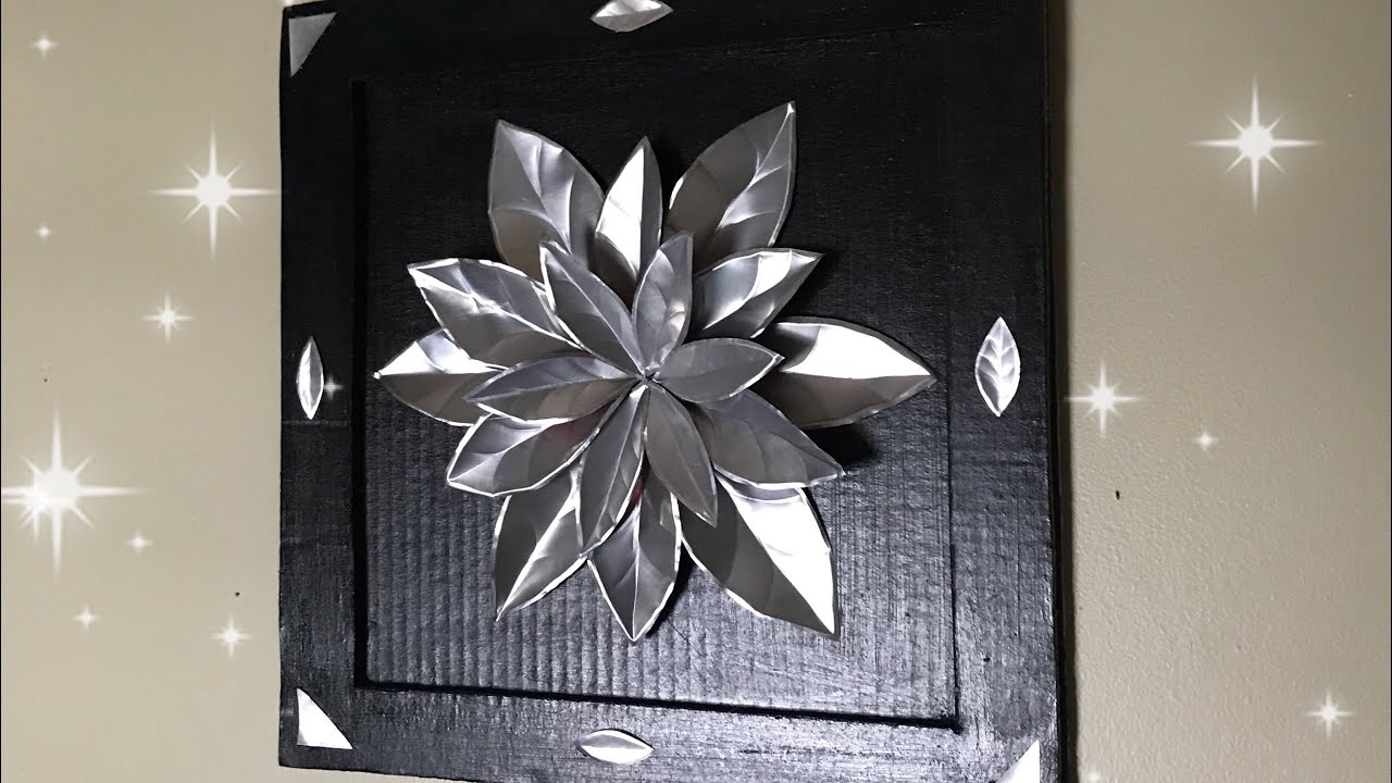 Cuadro con flor de latas de refresco y cartón/manualidades reciclando aluminio