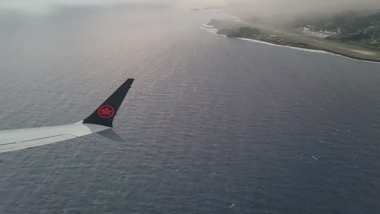Air Canada Boeing 737 Max 8 (C-FSES (507)) rainy Rwy 04 takeoff at Argyle International Airport