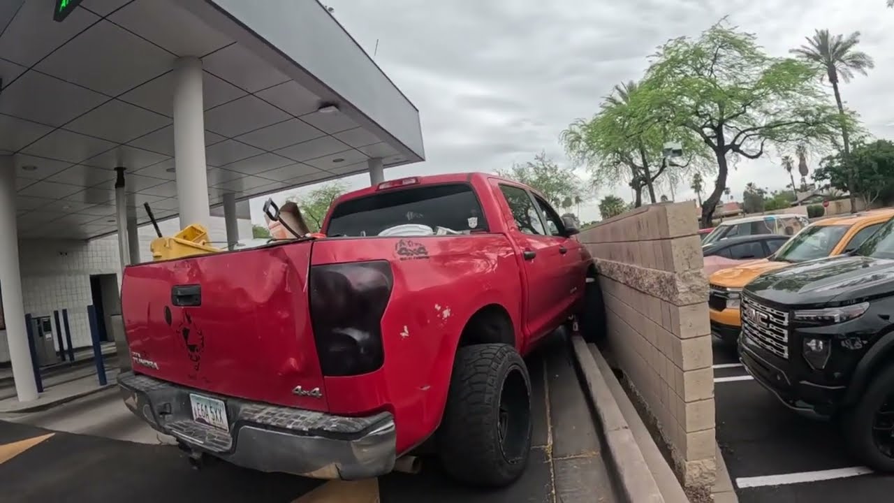 Toyota Tundra goes off the curb into a wall and needs extraction