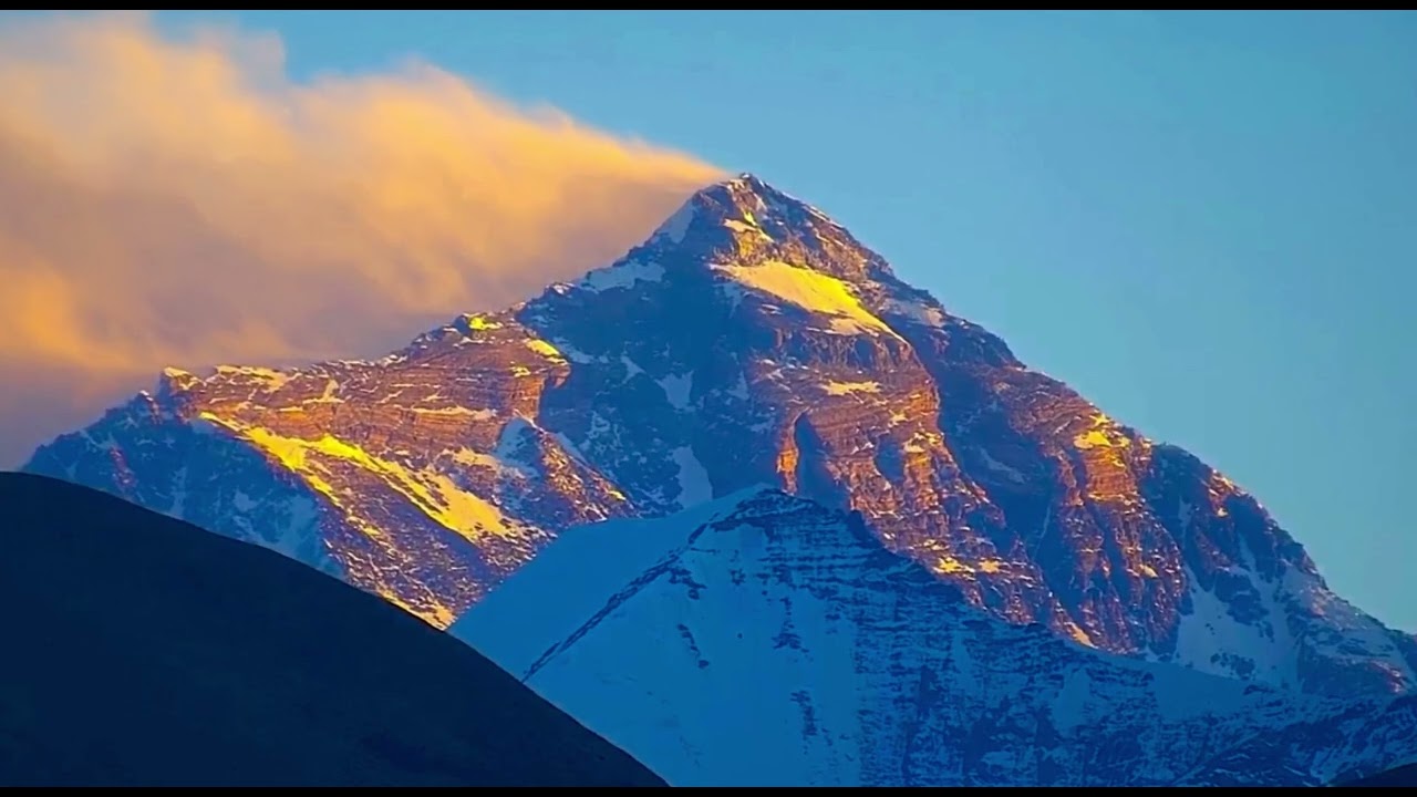 The sacred Mount Everest—golden sunrise over the mountain. Everest Grand Hotel