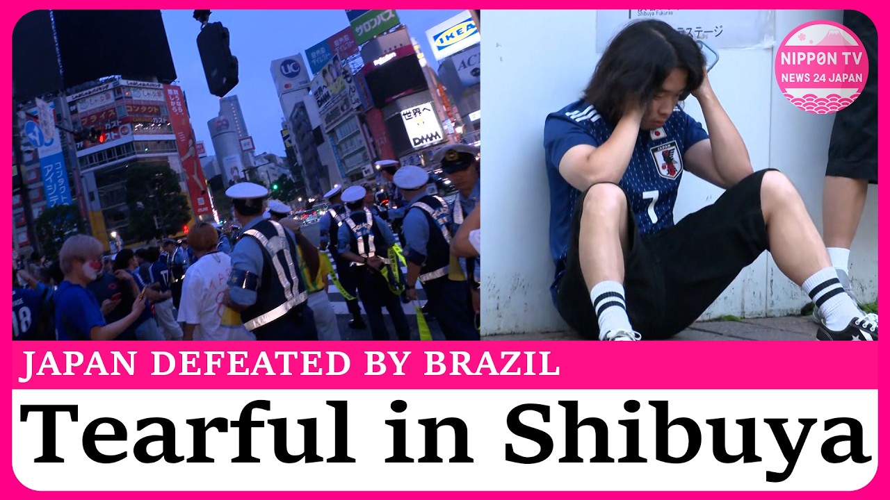 Tearful Japanese fans gather in Shibuya Crossing, after heartbreaking defeat to Brazil