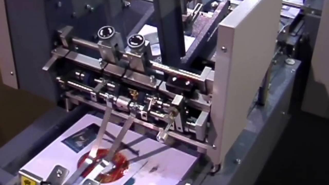 KAS Paper Systems  - Envelope inserter with overtrack feeders for DVD and plastic cards