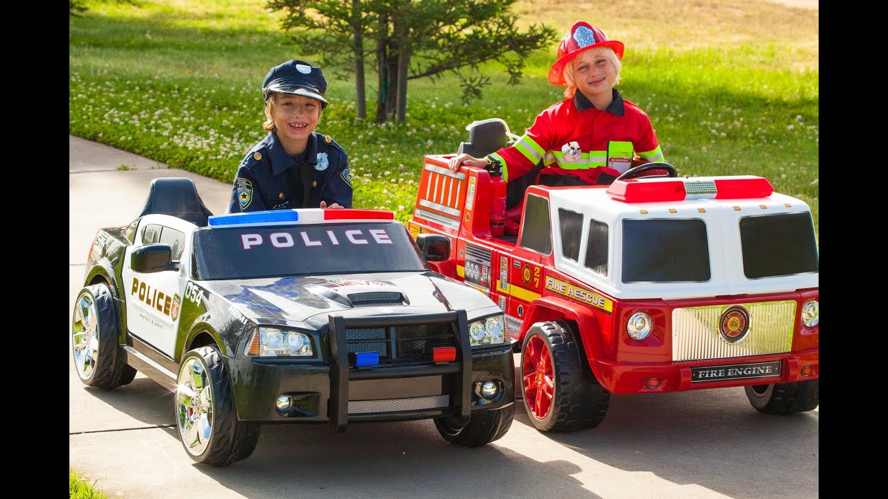 Power Wheels Race - Policeman (Sidewalk Cop) vs Fireman!