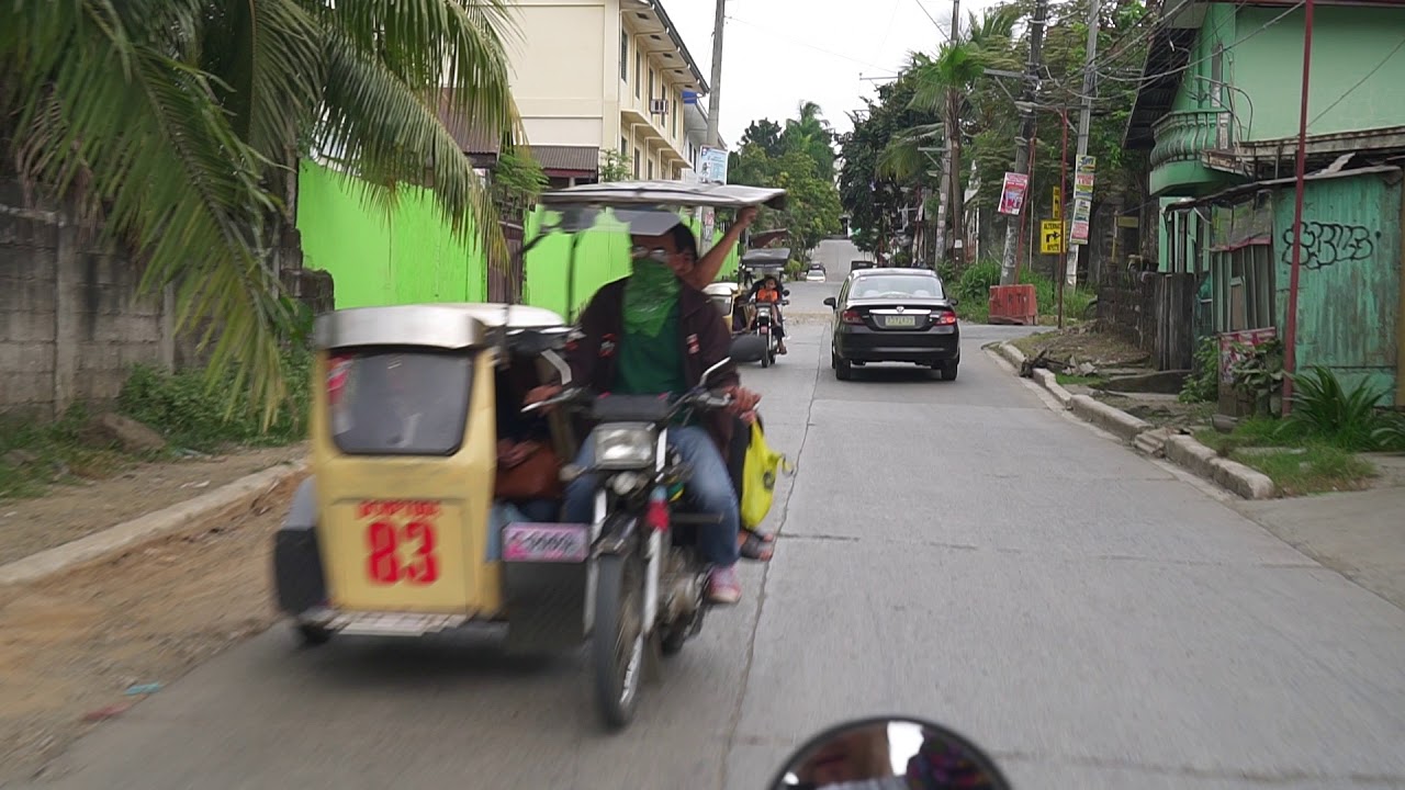 Philippines, tricycle ride from Dela Costa Homes III to Puregold