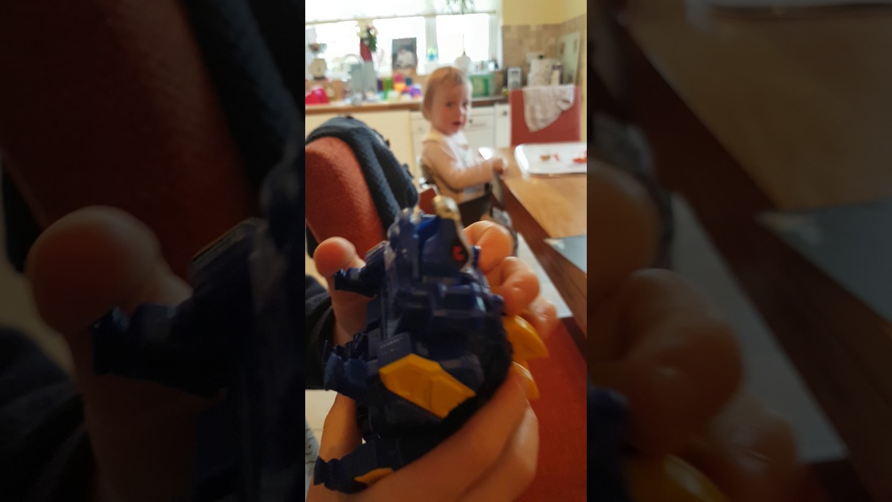 Orange and Grey Rangers demonstrate Stegozord