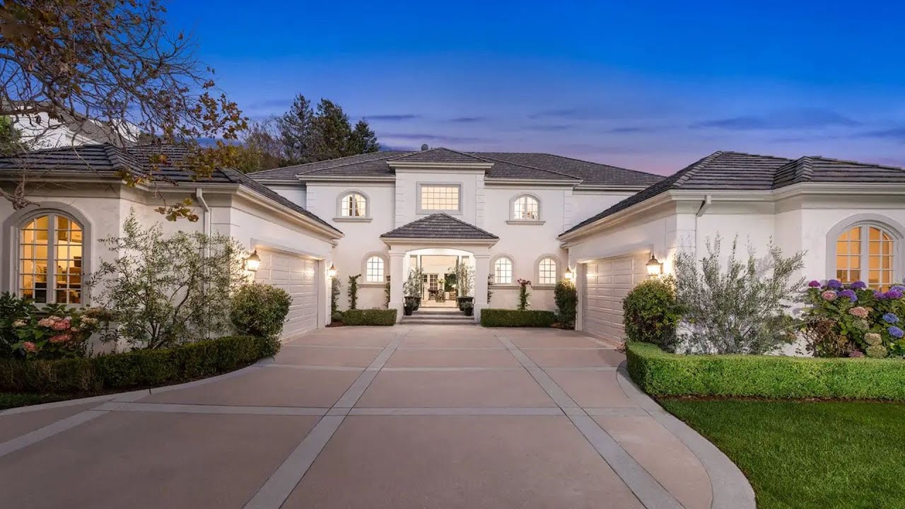 $9,495,000! Timeless and sophisticated transitional home in Pacific Palisades with romantic gardens