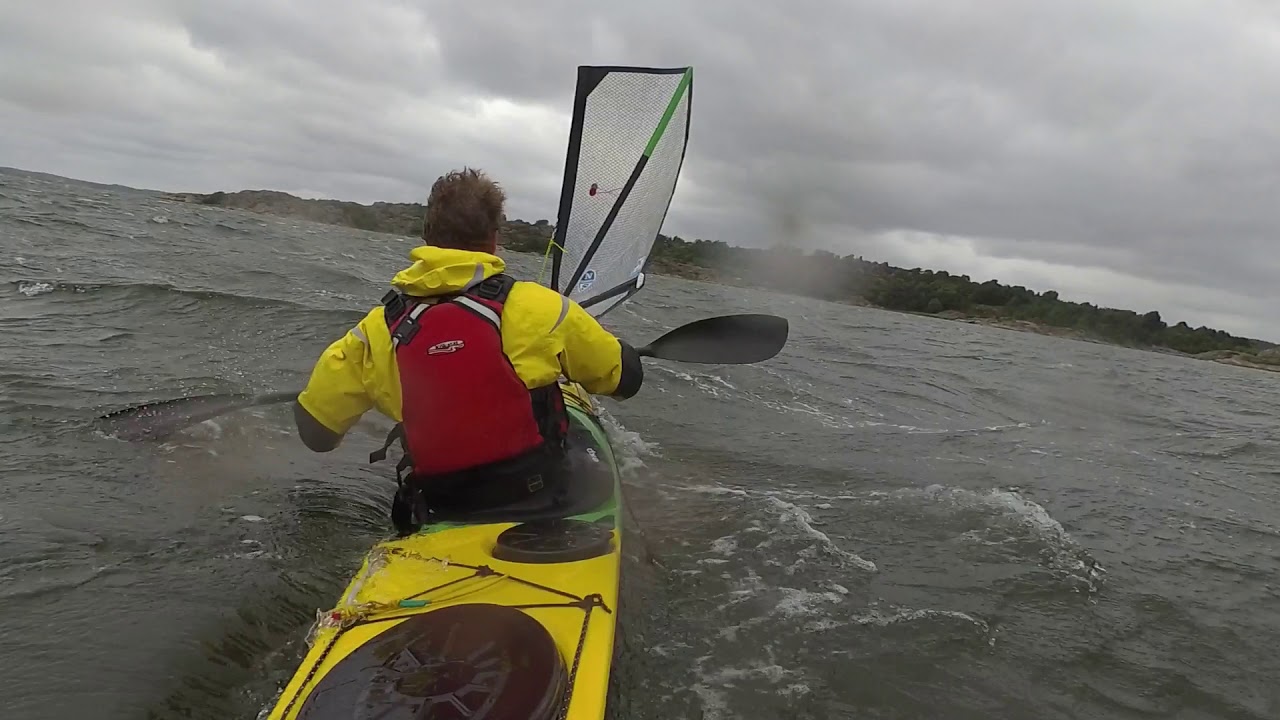 High wind kayak sailing.