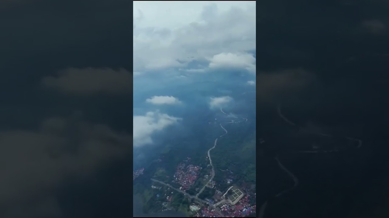 CRUX35 FPV Drone flying high in the clouds over Taal Lake in the Philippines.