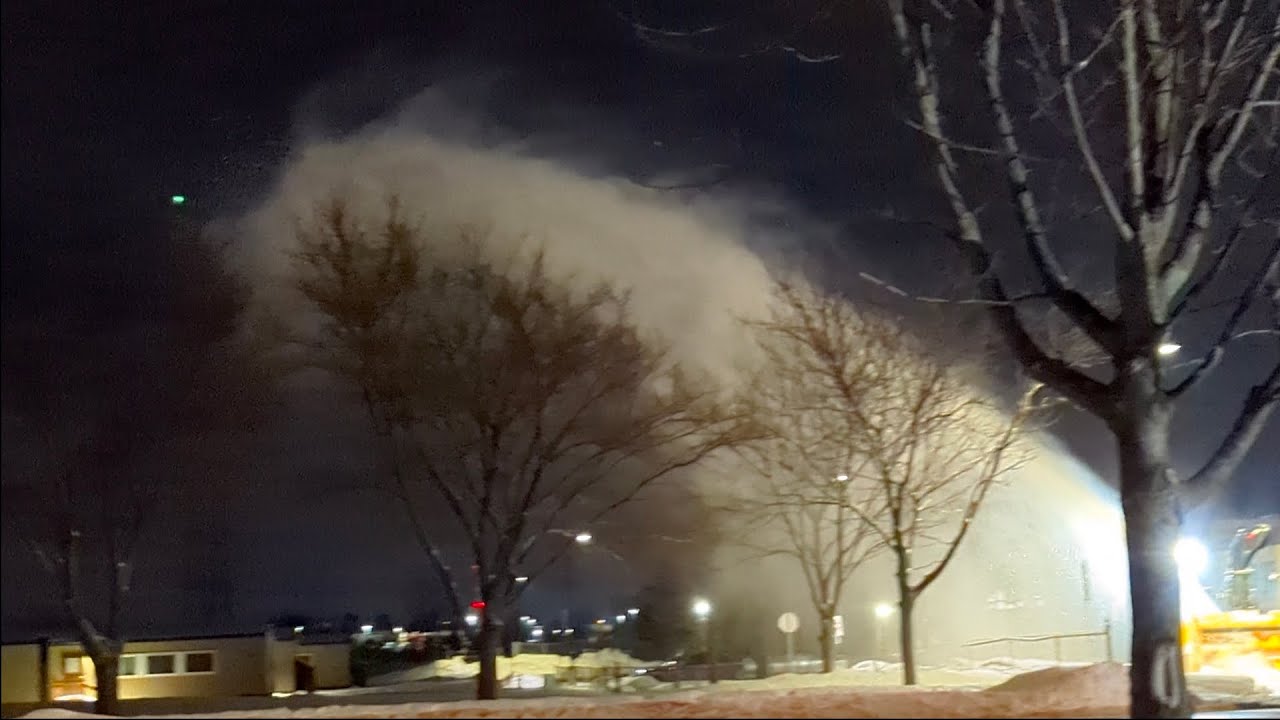 SnowBank Removal Squad blowing snow higher than the treetops