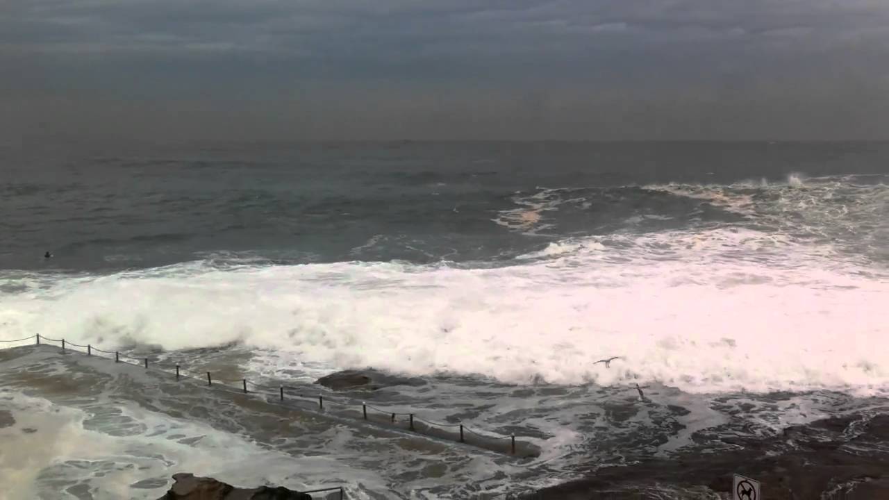 Massive Surf Waves at Dee Why Point flooding the pool like a tsunami - Sydney Australia - 2 May 2011