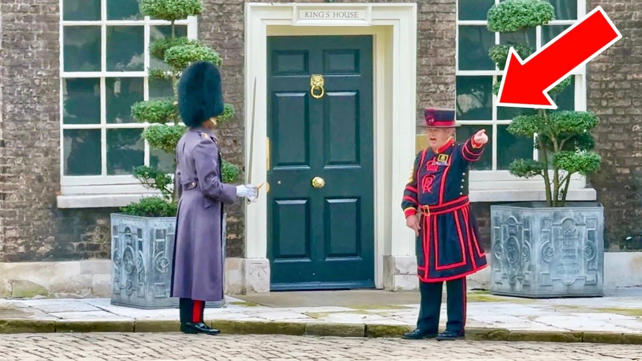 INSIDE TOWER OF LONDON: YEOMAN REMINDS GUARD TO DO HIS JOB