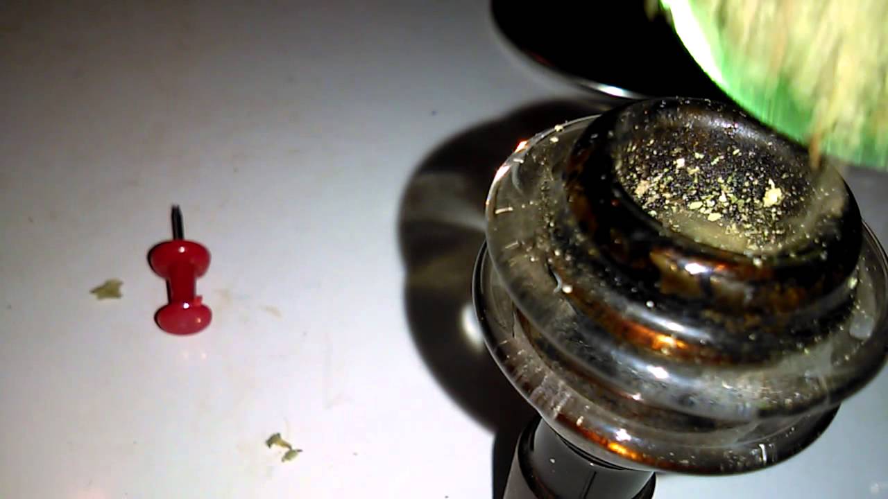 Bob Marley grinder, OG kush and a dab rig