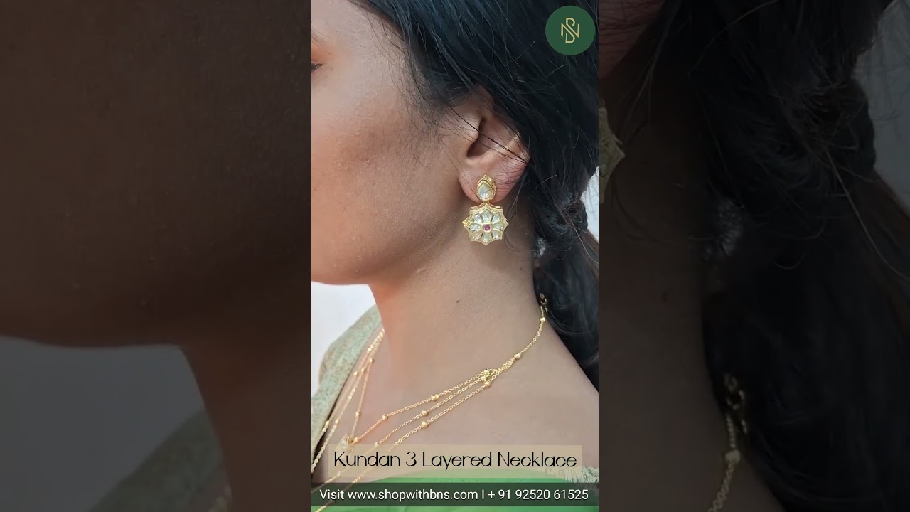 Elevate your festive look with this  3-layered Kundan necklace set, paired with matching earrings.