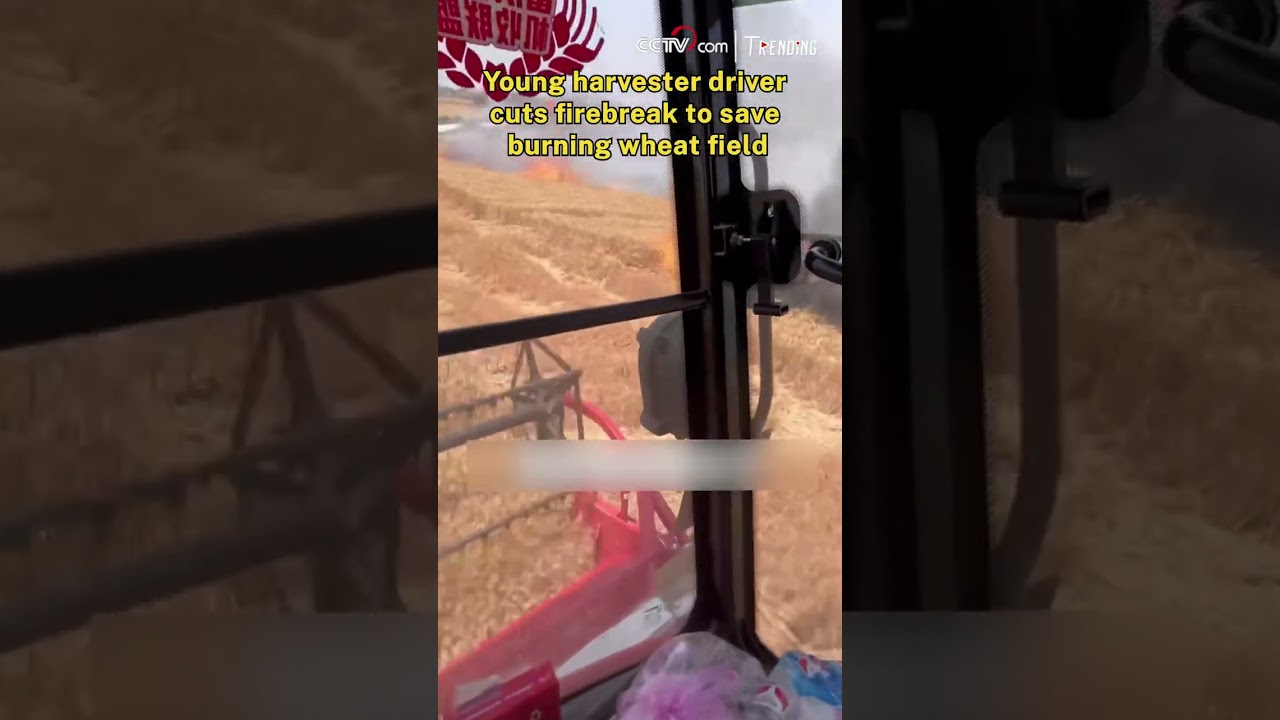 Young harvester driver cuts firebreak to save burning wheat field