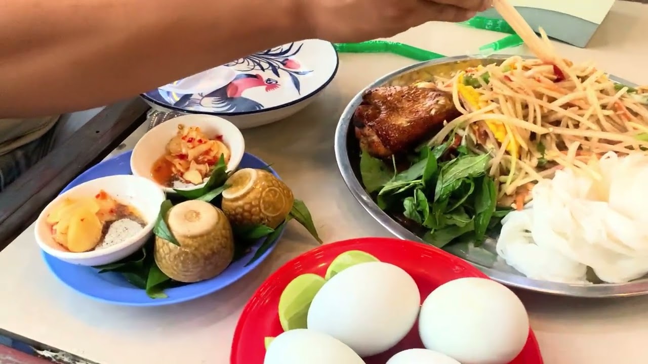 Eating papaya salad and baby duck eggs 