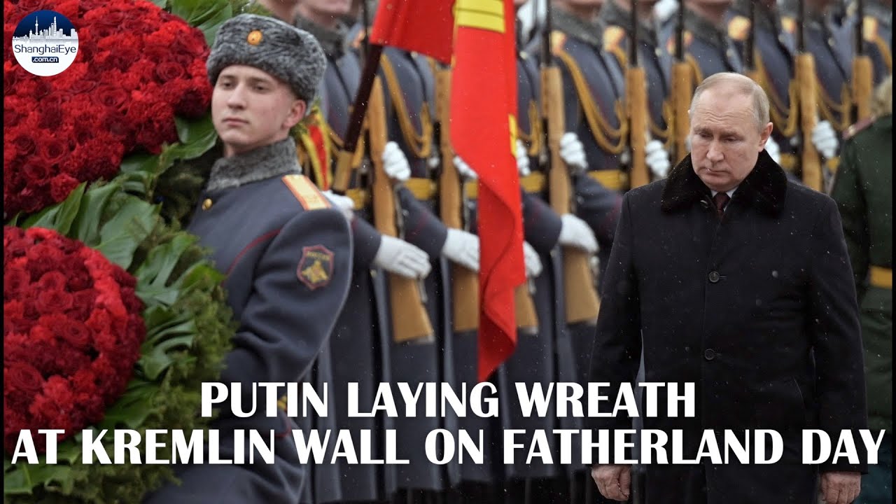 In silent snow, Putin lays wreath at tomb of the unknown soldier in Moscow