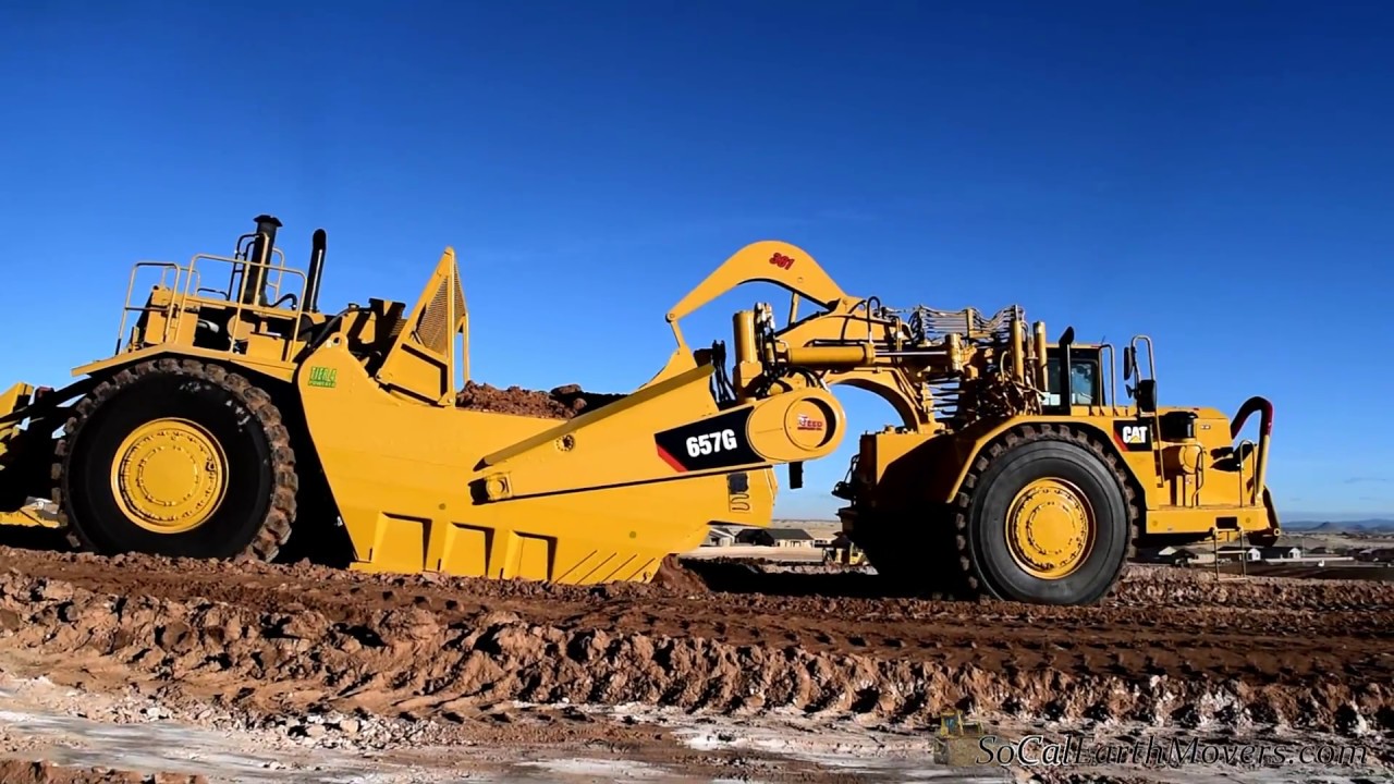 Pair of brand new CATERPILLAR 657G scrapers