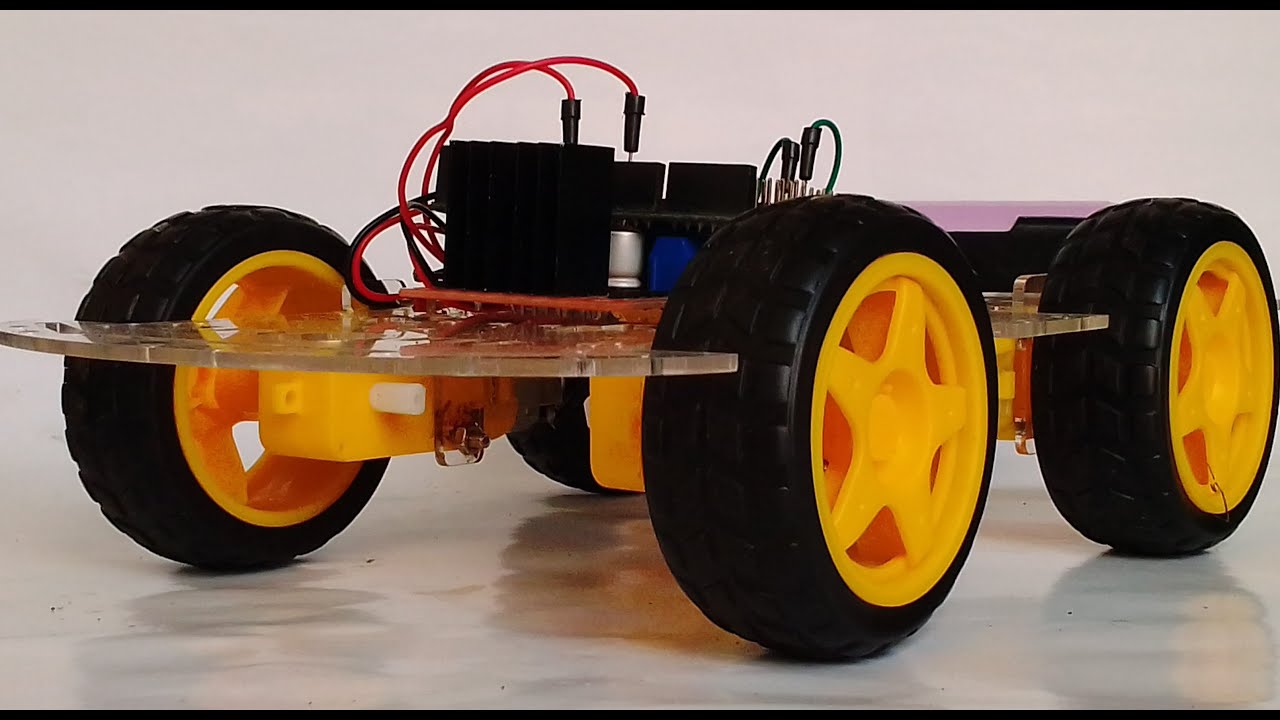 How to make a forward and reverse moving robotic car using arduino