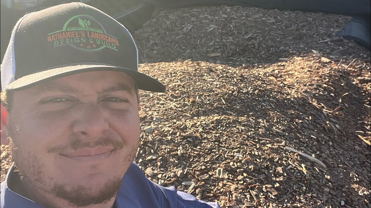 Adding my FREE mulch to my flowerbeds and using a surprising method for weed barrier.