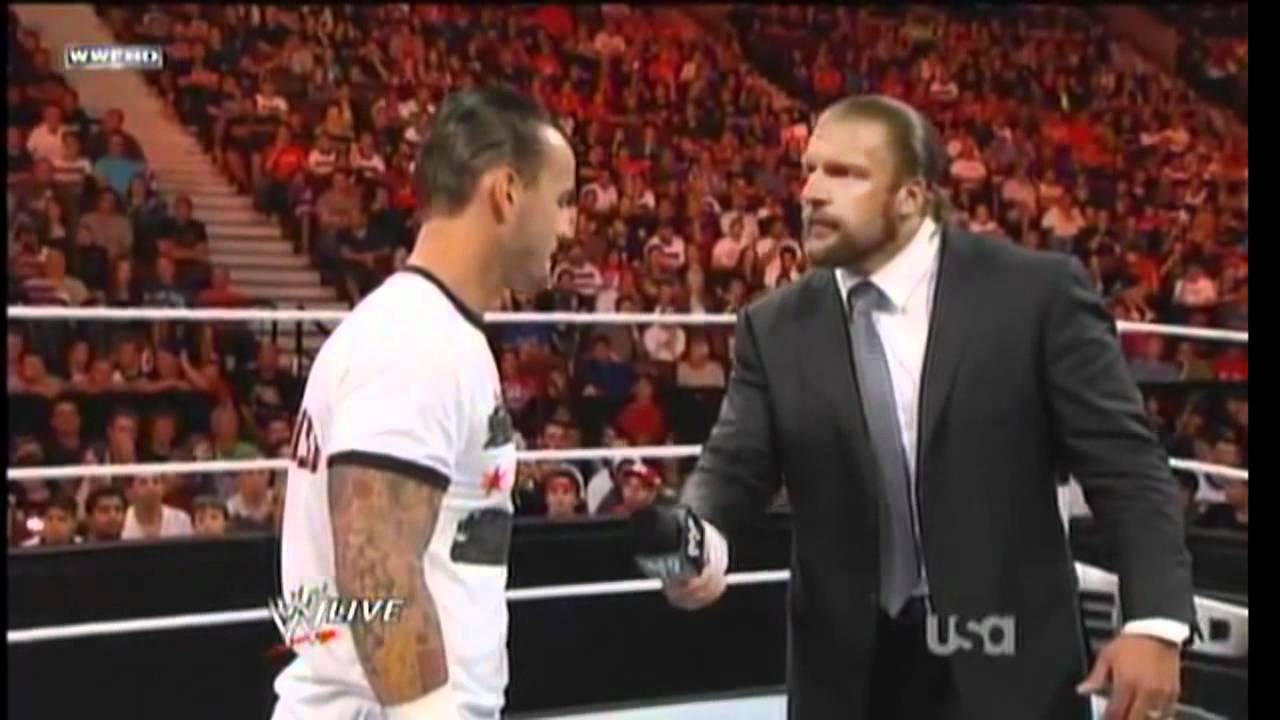 CM Punk's hits Triple H with a pipe bomb after mic cutoffs