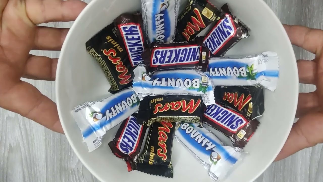 ASMR candy Mars, Snickers, and Bounty on a plate