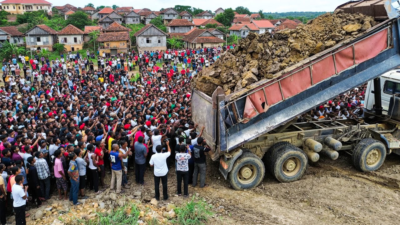 Nice bulldozer skill pushing soil filling land with dump trucks unloading dirt amazingly