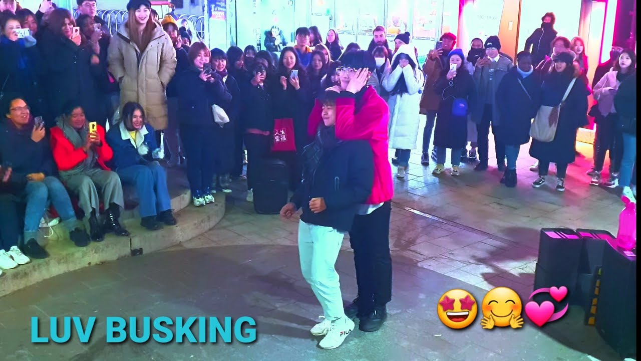 MAXXAM. ENJOYING UNFORGETTABLE HILARIOUS BUSKING WITH ONLOOKER.