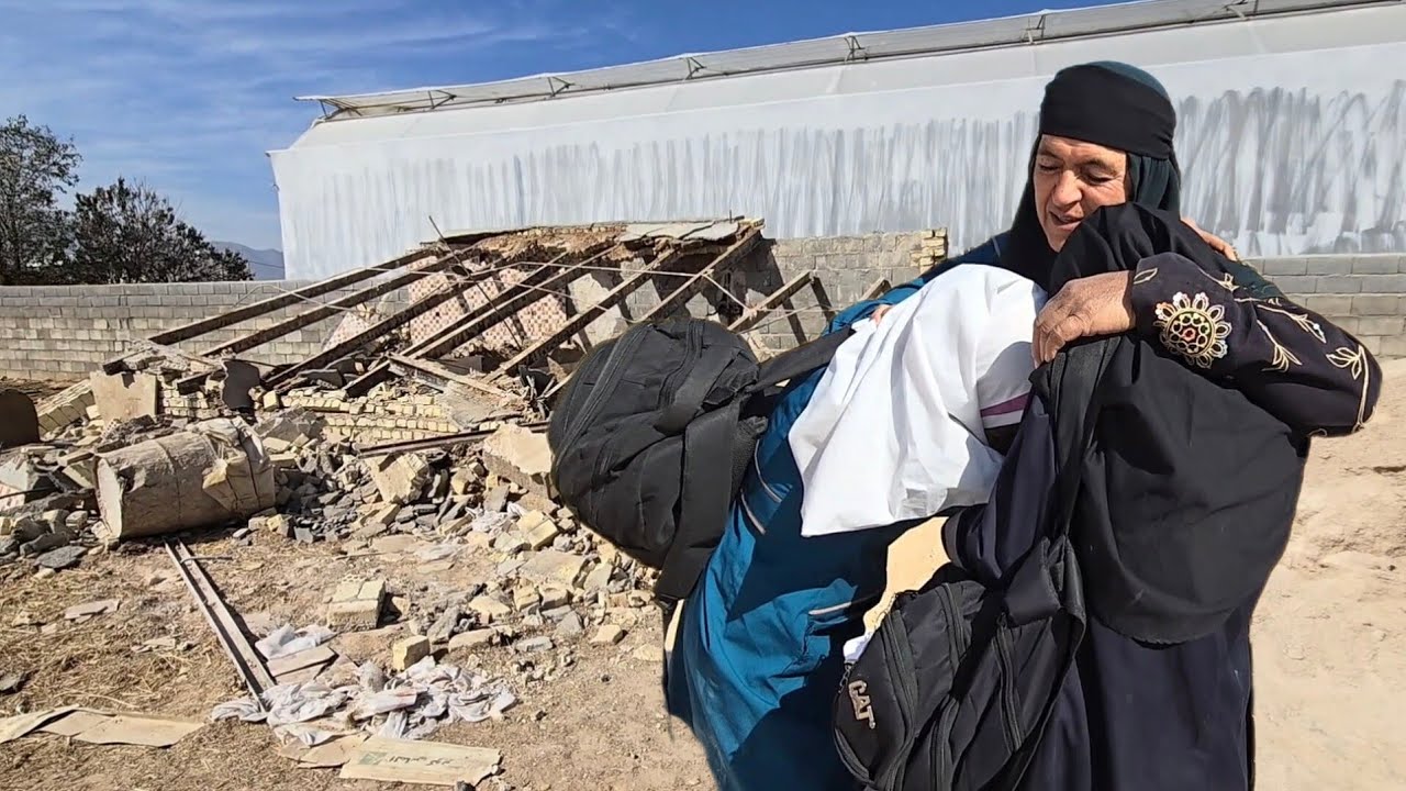 The sad tears of two orphan girls in grandmother's arms: Their home was destroyed