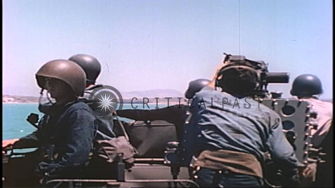 A US destroyer lays a smoke screen off the coast of Licata during World War II. HD Stock Footage