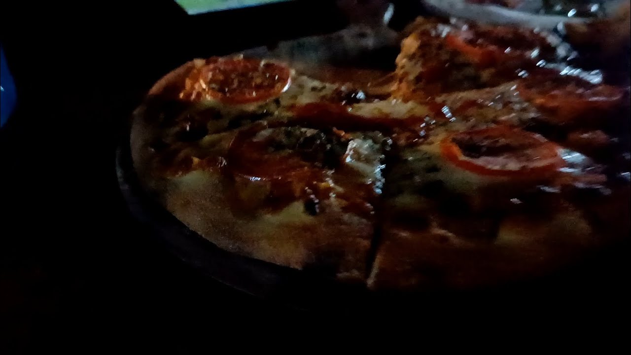 Pizza pity with friend in four came golden tempal