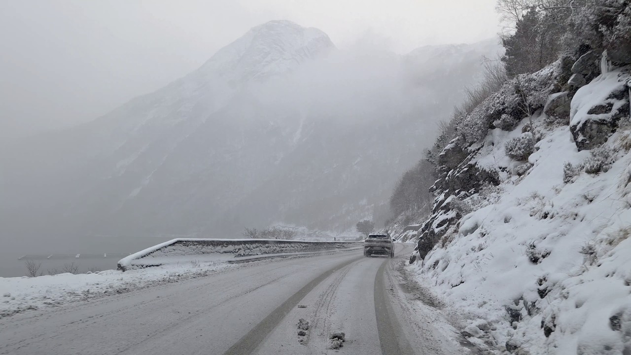 E39 from Førde to Lavik - gorgeous landscapes, sleet and slush on the road, overly cautious drivers.
