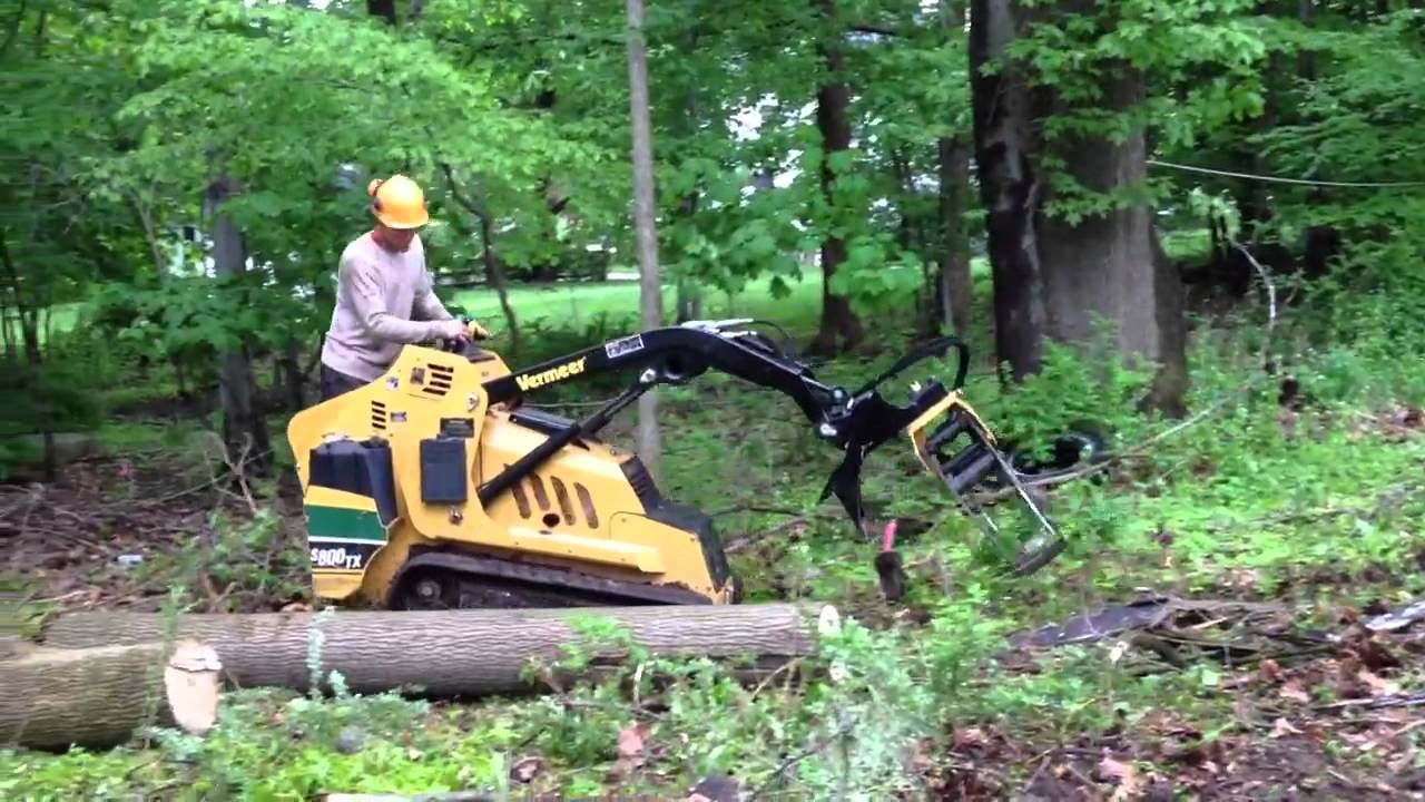 Vermeer mini loader with log grapple