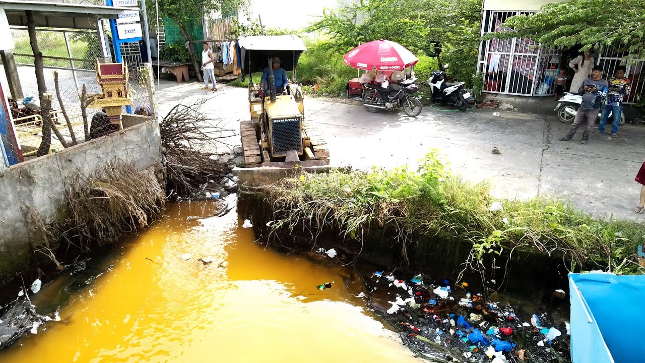 Complete the plan to pour rock into a long and narrow flooded area using small machinery  1
